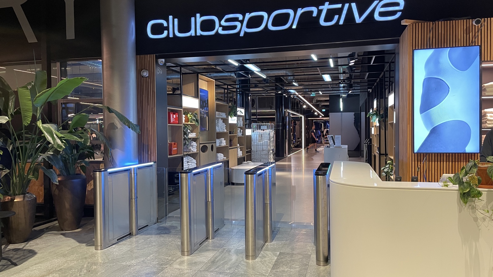Doorsecure speed gates integrated into a reception with timber finishes